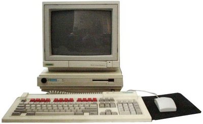 A310 system - monitor sitting on a flat base unit, with a matching keyboard and mouse.  The base unit has a 3.5" floppy drive in one side.