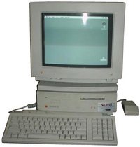 A Mac IIsi switched on and working.  Very similar to the Mac above, but the floppy is in the base unit and the screen is bigger (and in colour)