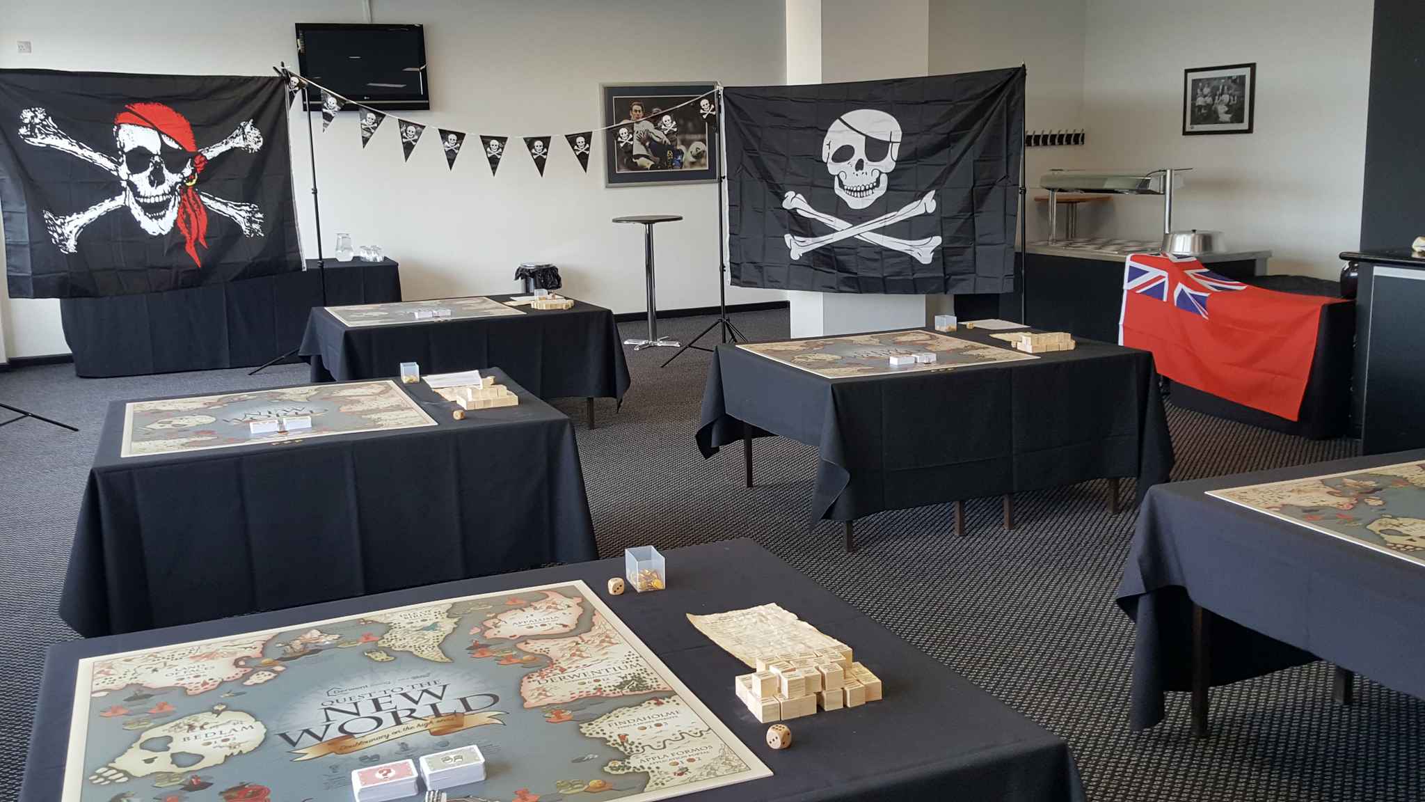 A large room with several tables that have the board game on them
