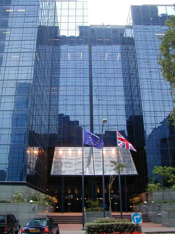 The hosting facility from outside - an impressive glass fronted tower, with flags outside.