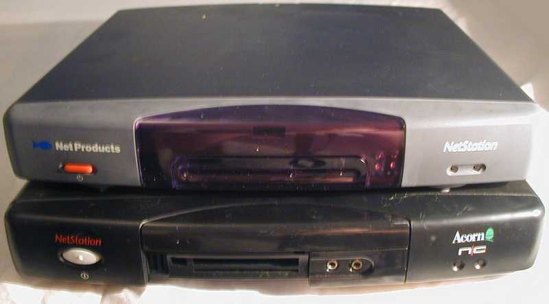 Two NCs stacked on top of one another (Acorn on bottom, NetStation on top). Small rectangular boxes containing internet computers for attaching to your TV.