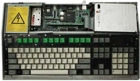 A3010 with the top taken off, revealing the network card, a power supply and a floppy drive